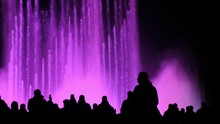 A Crowd Of Tourists Watching A Show Of Magical Dancing Fountains