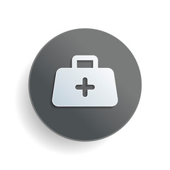 Wall Mural - first-aid kit, simple icon. White paper symbol on gray round button or badge with shadow