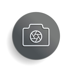 Wall Mural - Photo camera with shutter, linear symbol with thin outline, simple icon. White paper symbol on gray round button or badge with shadow