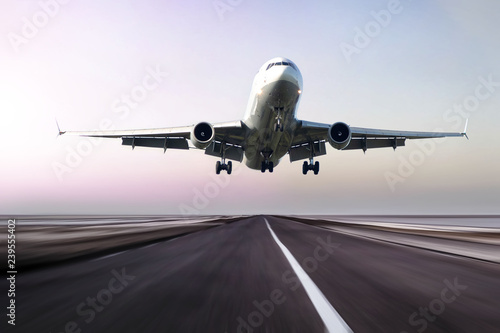 plane takes off at sunrise Lerretsbilde