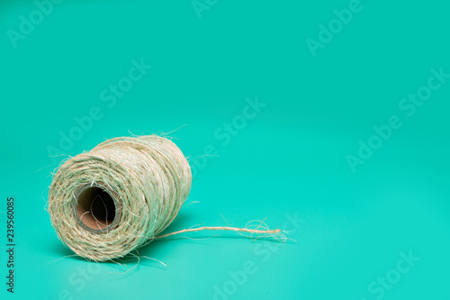 Fotografía Cord. packing tape roll, green background