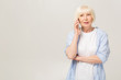 © denis_vermenko - Atrractive senior caucasian woman talking on smartphone over isolated background scared in shock with a surprise face, afraid and excited with fear expression.