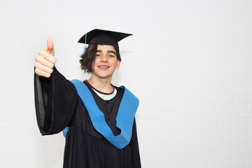 young isolated in a graduation suit