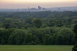 distant view of the city of Hartford, Ct at sunset from a hill on a warm and hazy spring evening 