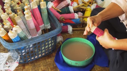 Wall Mural - Thai Artisan Making Paper Umbrellas in Local Workshop