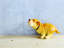 Dog Statue Ceramic With Space Copy On Wooden Background