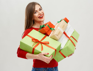 caucasian smilimg woman holding heap of gift boxes.