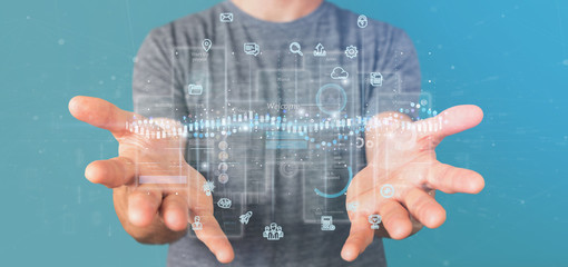 Businessman holding User interface screens with icon, stats and data 3d rendering