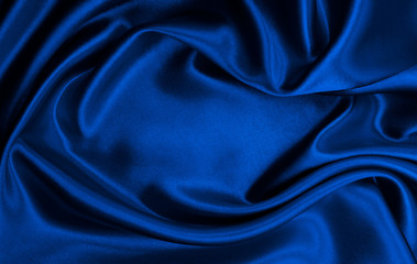smooth elegant blue silk or satin luxury cloth texture as abstract background. luxurious christmas b