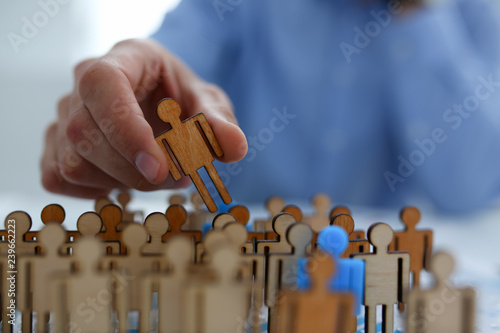 Cuadros en Lienzo Businessman in blue shirt is holding a magnifying