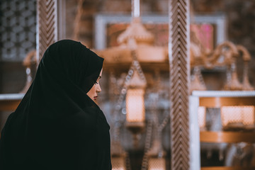 muslim woman praying in mosque