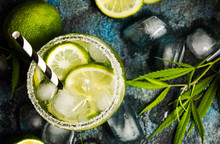 Lime Cocktails With Marijuana On Stone Table