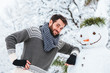 © marjan4782 - Young man making snowman in the park