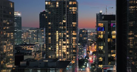 Fototapete - Buildings of downtown Los Angeles at dusk. Night city timelapse.
