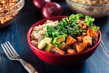 Colorful buddha bowl with quinoa and roasted and fresh vegetables