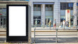 © viperagp - Empty billboard for public advertisement at the bus stop. Space for text. People and city background.