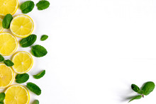 White Background With Lemon, Orange Slices And Mint. Concept With Fresh Fruit. Lemon, Orange, Mint. View From Above.