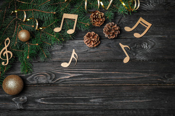 Composition with wooden music notes and space for text on table, top view