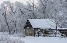 Old Wooden Shed During A Snowfall
