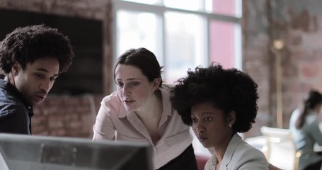 coworkers in a casual meeting discussing work