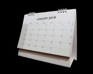 Desktop calendar of January 2019 isolated on black background.