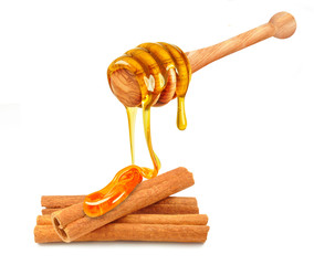 Sticker - honey dripping on cinnamon isolated on a white background