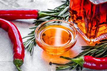 chili oil with ingredients on kitchen table background