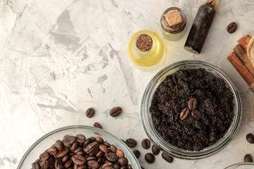 Wall Mural - homemade coffee scrub in a jar for the face and body, and various ingredients for making scrub on a light background. spa. cosmetics. care cosmetics. top view with space for text