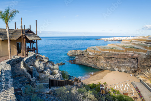 Fotomural Beautiful small bay with sand beach and wooden house on top of hiking path to it