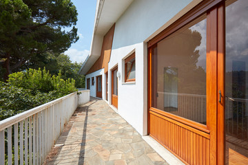 Sunny terrace and large window in country house