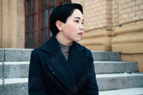 Melancholic Portrait Of Young Asian Woman With Short Hair Style