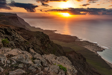 Wall Mural - View at Atlantic ocean and La Graciosa island at sunset from El Mirador del Rio in Lanzarote, Canary Islands, Spain.