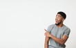 © Prostock-studio - African-american man pointing aside at copy space