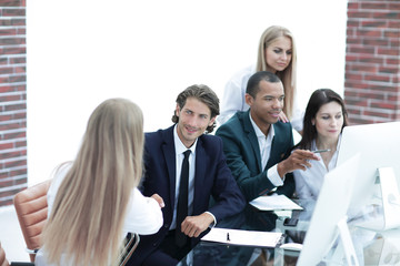 handshake business people at the negotiating table.