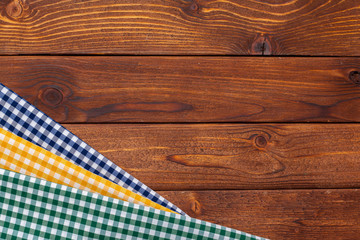 Wall Mural - checkered tablecloth on wooden table