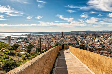 Canvas Print - View of ramp connecting Santa Barbara castle with downtown Alicante; high angle view of the city and the Mediterranean sea.