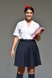 © dtiberio - Cute Colombian Student Teenager School Girl Standing With Notebook