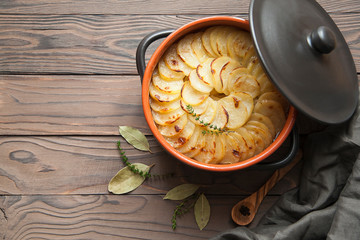 Canvas Print - Homemade Lancashire hotpot - a stew  consists of lamb, onion, carrot, Worcestershire sauce, topped with sliced potatoes, bay leaves, thyme  and baked in a heavy pot on a low heat.