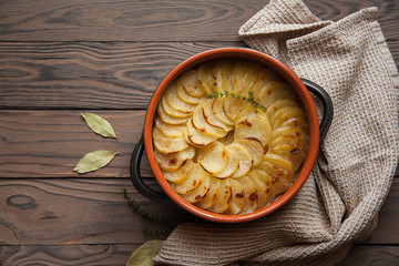 Canvas Print - Homemade Lancashire hotpot - a stew  consists of lamb, onion, carrot, Worcestershire sauce, topped with sliced potatoes, bay leaves, thyme  and baked in a heavy pot on a low heat.