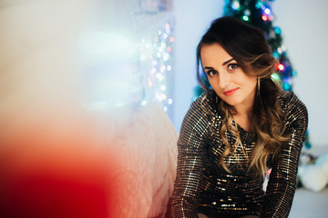 Beautiful girl with a glass of champagne, Christmas and new year background