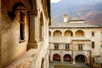 Wall Mural - Issogne: Castle of Issogne. The courtyard with the pomegranate fountain. Val D'aosta, Italy.