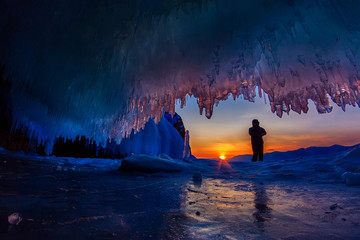 Sticker - sunset in a cave grotto with icicles in the winter on Olkhon Island, Lake Baikal