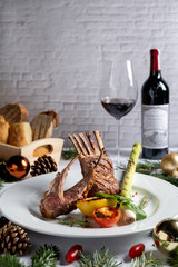 Wall Mural - Luxury dinner menu grilled lamb, pasta lobster during Christmas and New year. Decrated with festive elements, wine, bred, red burry. Beautiful classic background with space.