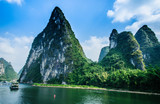 Fototapeta  - Beautiful mountains and river scenery with blue sky, Yangshuo, China.
