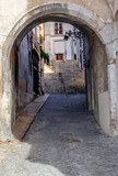Fototapeta Na drzwi - Lisbon - Portugal, access by a stone arch to the famous Alfama district