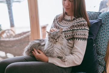 Wall Mural - Girl relaxing with cat at home