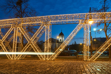 Wall Mural - Christmas illumination in the shape of a bridge structure in Poznan..