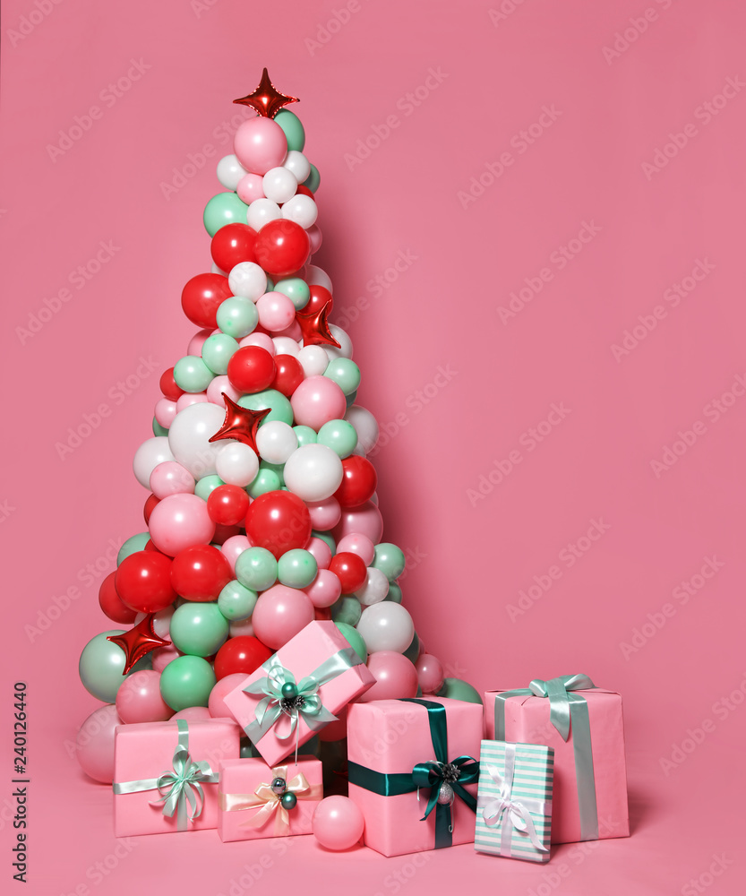 Christmas tree made of many pastel color balloons and pastel color pink ...