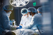 © alfa27 - Operation room surgery in hospital, blurred figures. Professional treatment and professional conduct concept.