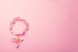 Gender Venus symbol made of beautiful flower petals on candy pink background, copy space for text